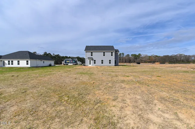 a front view of a house with yard