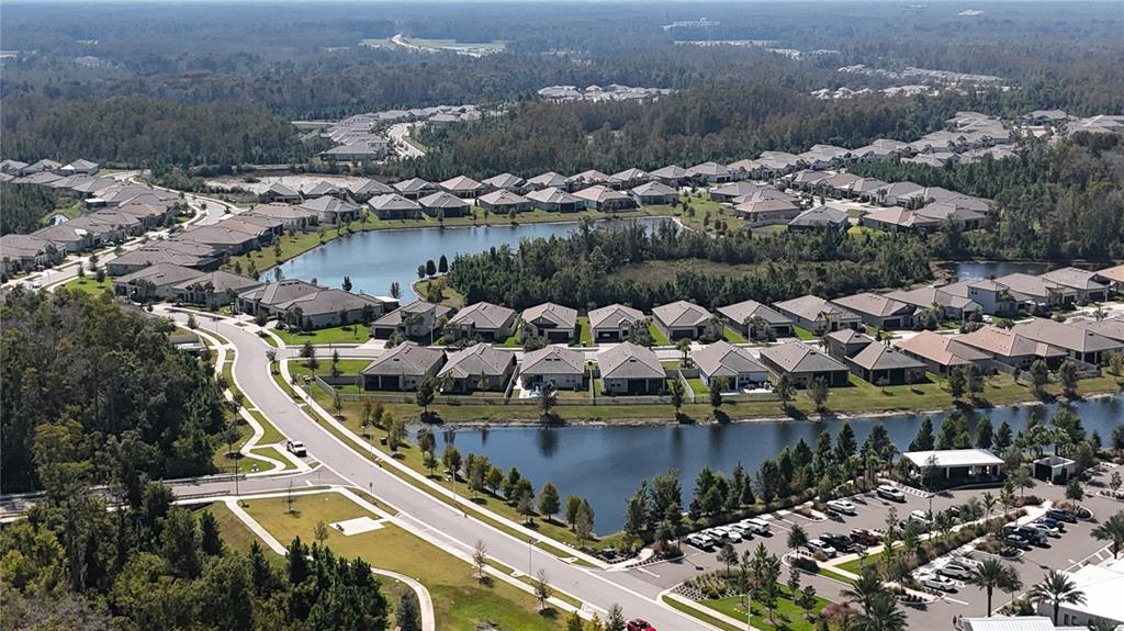 12510 Robinhood Road Hudson, FL 34669 - Photo 24 of 30 an aerial view of a house with a lake view