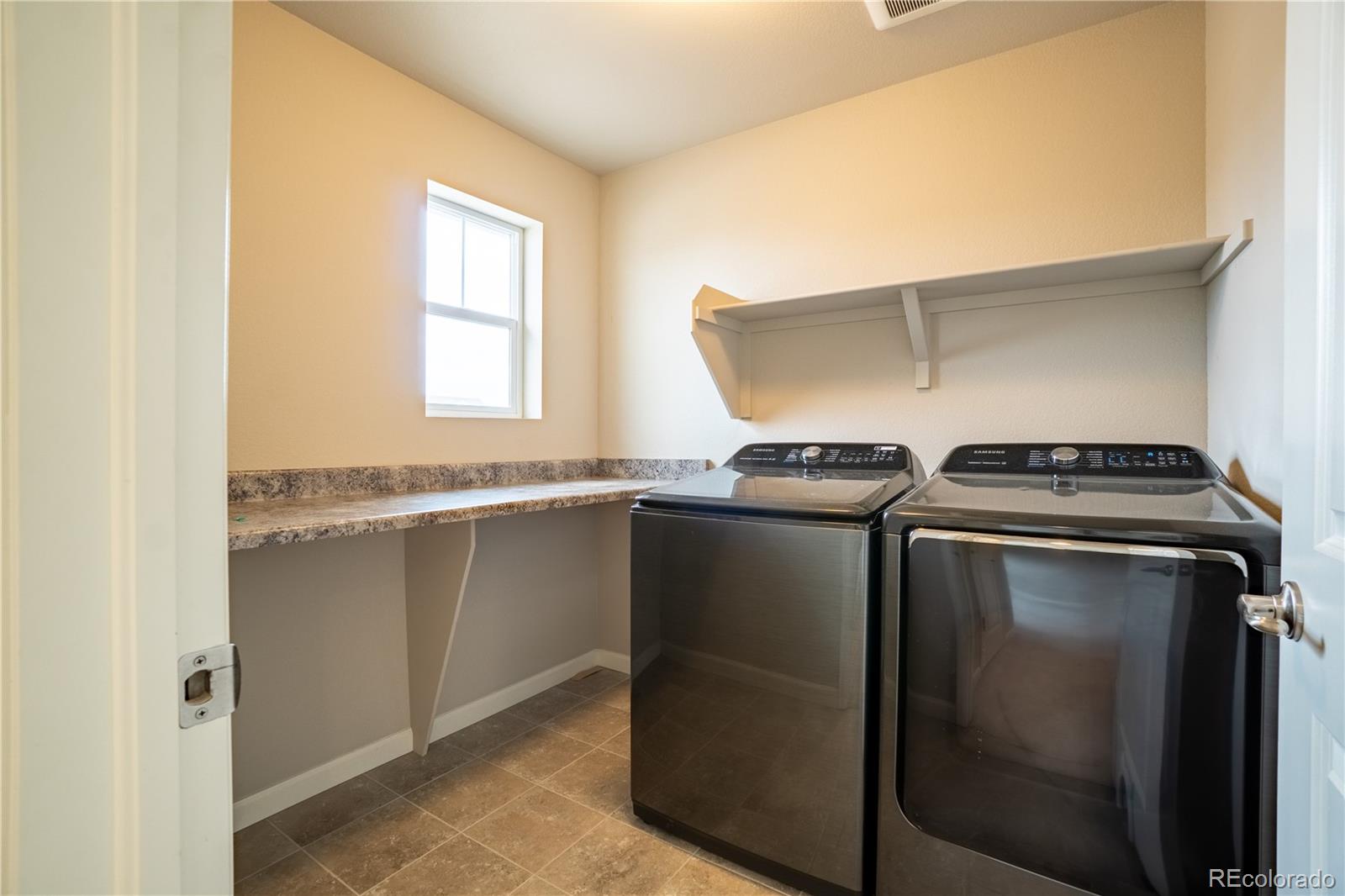 643 Ranchhand Drive Berthoud, CO 80513 - Photo 15 of 39 a utility room with washer and dryer
