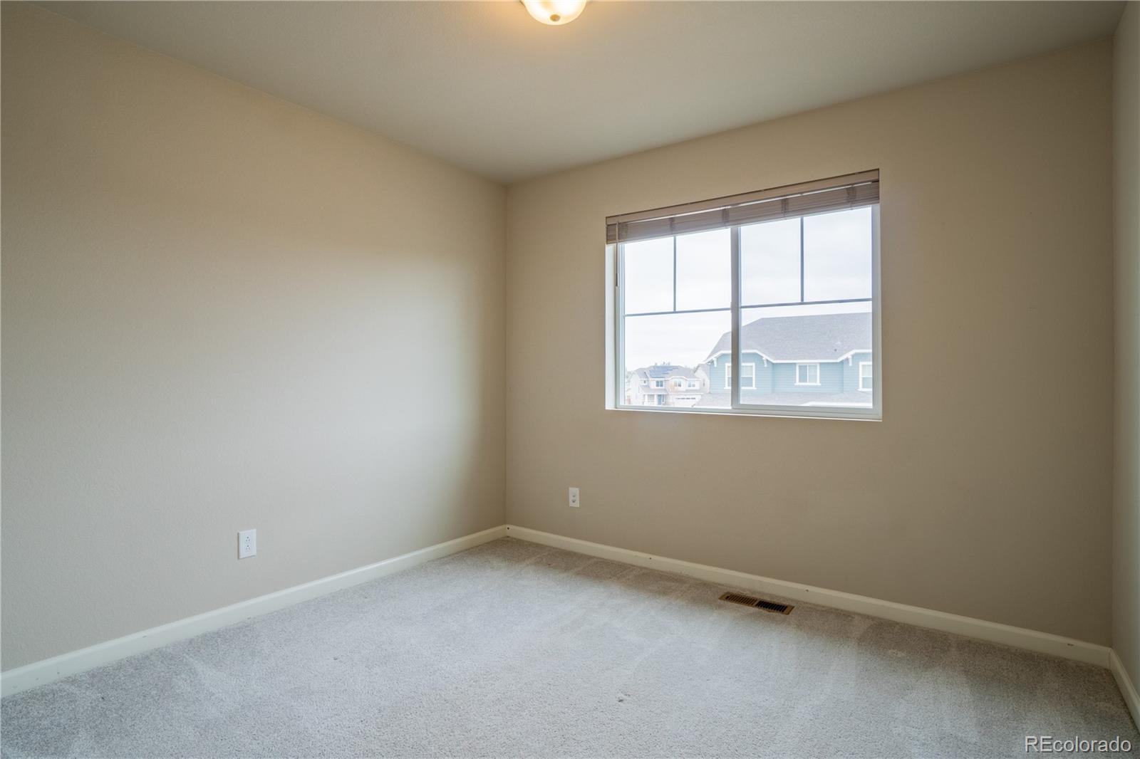 643 Ranchhand Drive Berthoud, CO 80513 - Photo 23 of 39 an empty room with a window