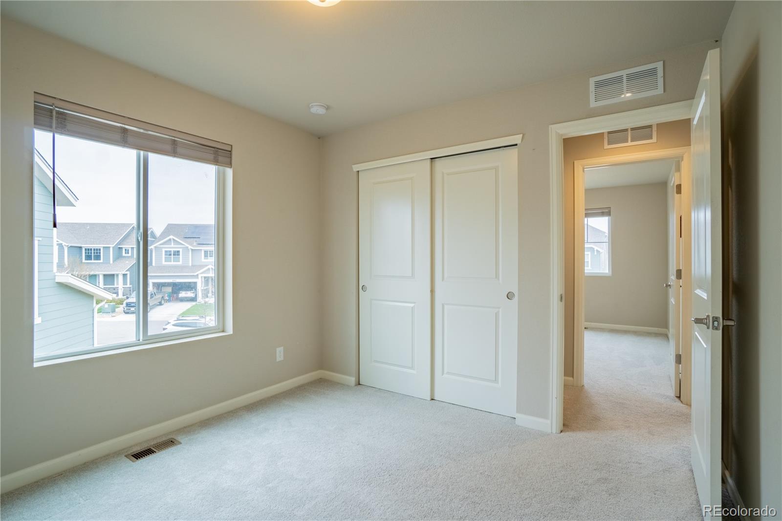 643 Ranchhand Drive Berthoud, CO 80513 - Photo 29 of 39 a view of an empty room with window and closet area