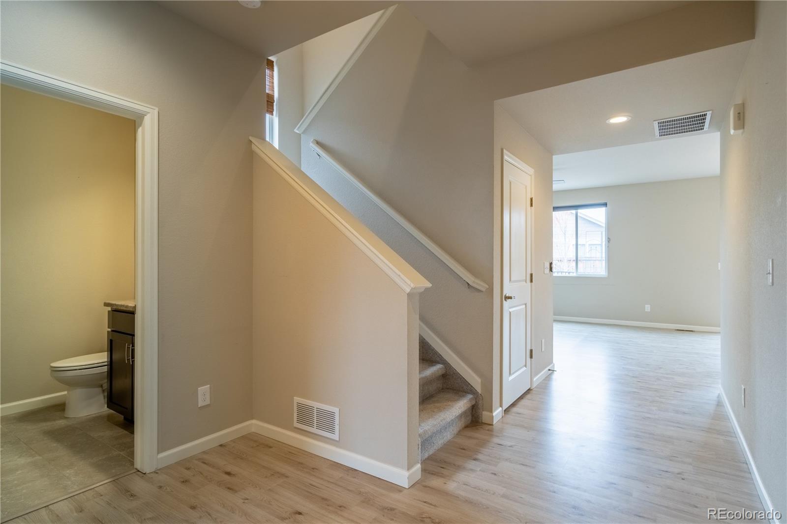 643 Ranchhand Drive Berthoud, CO 80513 - Photo 3 of 39 a view of a hallway with wooden floor and entryway