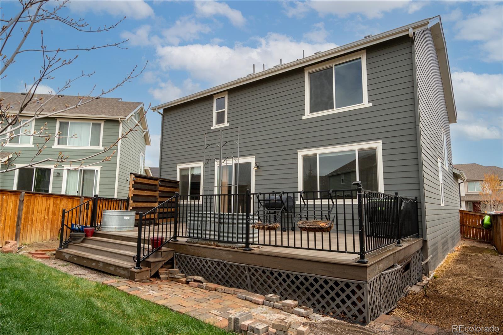 643 Ranchhand Drive Berthoud, CO 80513 - Photo 31 of 39 a view of a house with backyard and wooden fence