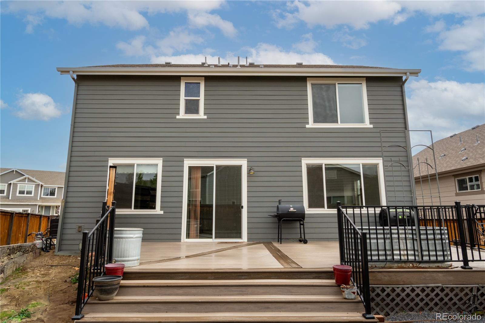 643 Ranchhand Drive Berthoud, CO 80513 - Photo 32 of 39 a view of a house with a balcony and door