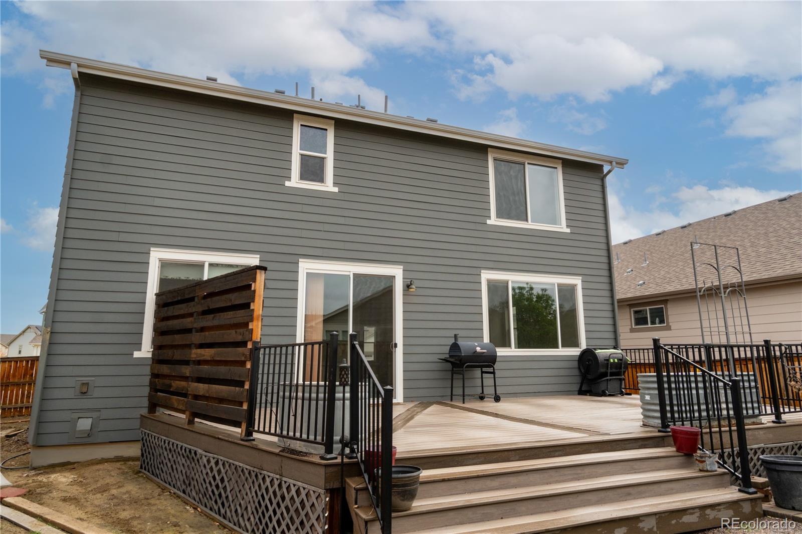 643 Ranchhand Drive Berthoud, CO 80513 - Photo 33 of 39 a view of a house with a balcony and door space