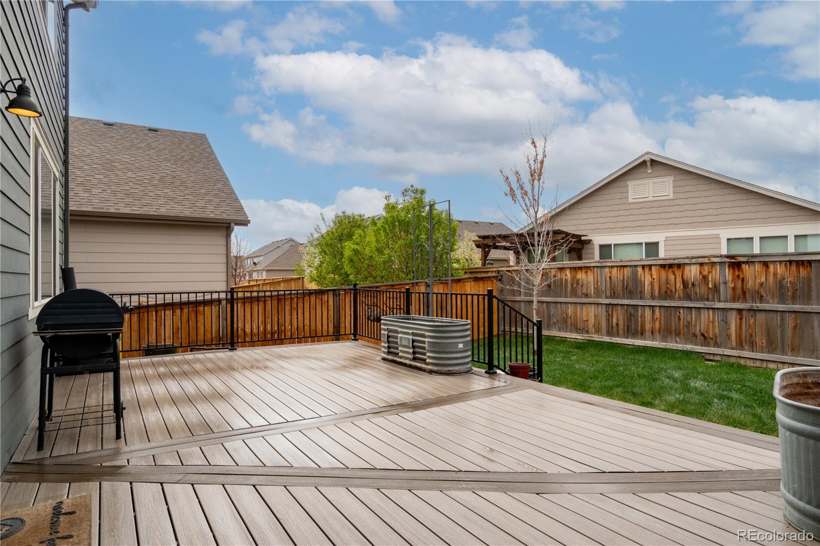 643 Ranchhand Drive Berthoud, CO 80513 - Photo 35 of 39 a view of a deck with a chair and table of the house