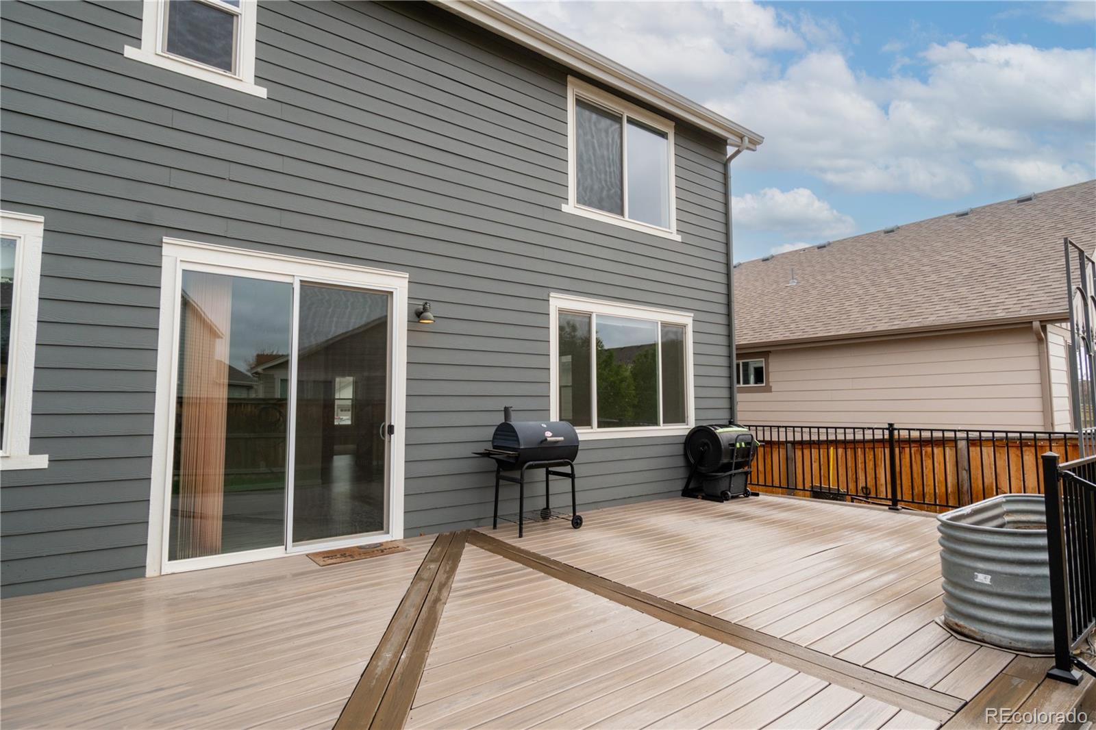 643 Ranchhand Drive Berthoud, CO 80513 - Photo 38 of 39 a view of a wooden deck with furniture