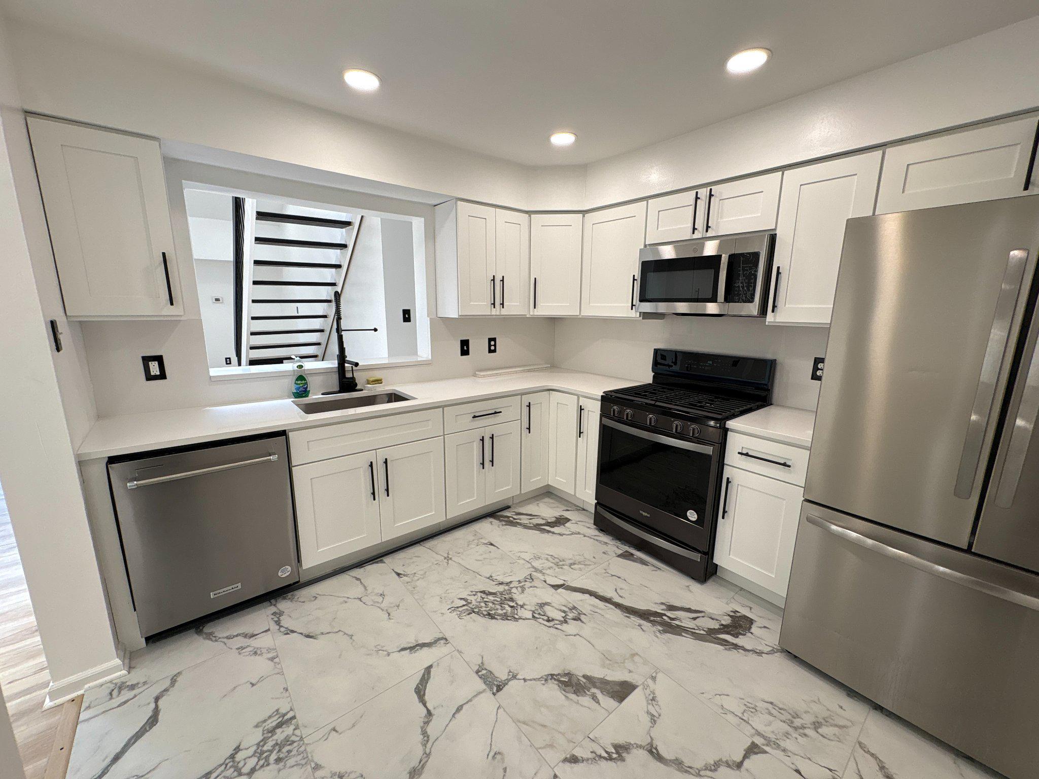72304 Delaire Landing Road, Unit 304 Philadelphia, PA 19114 - Photo 21 of 56 Modern kitchen with sleek finishes.