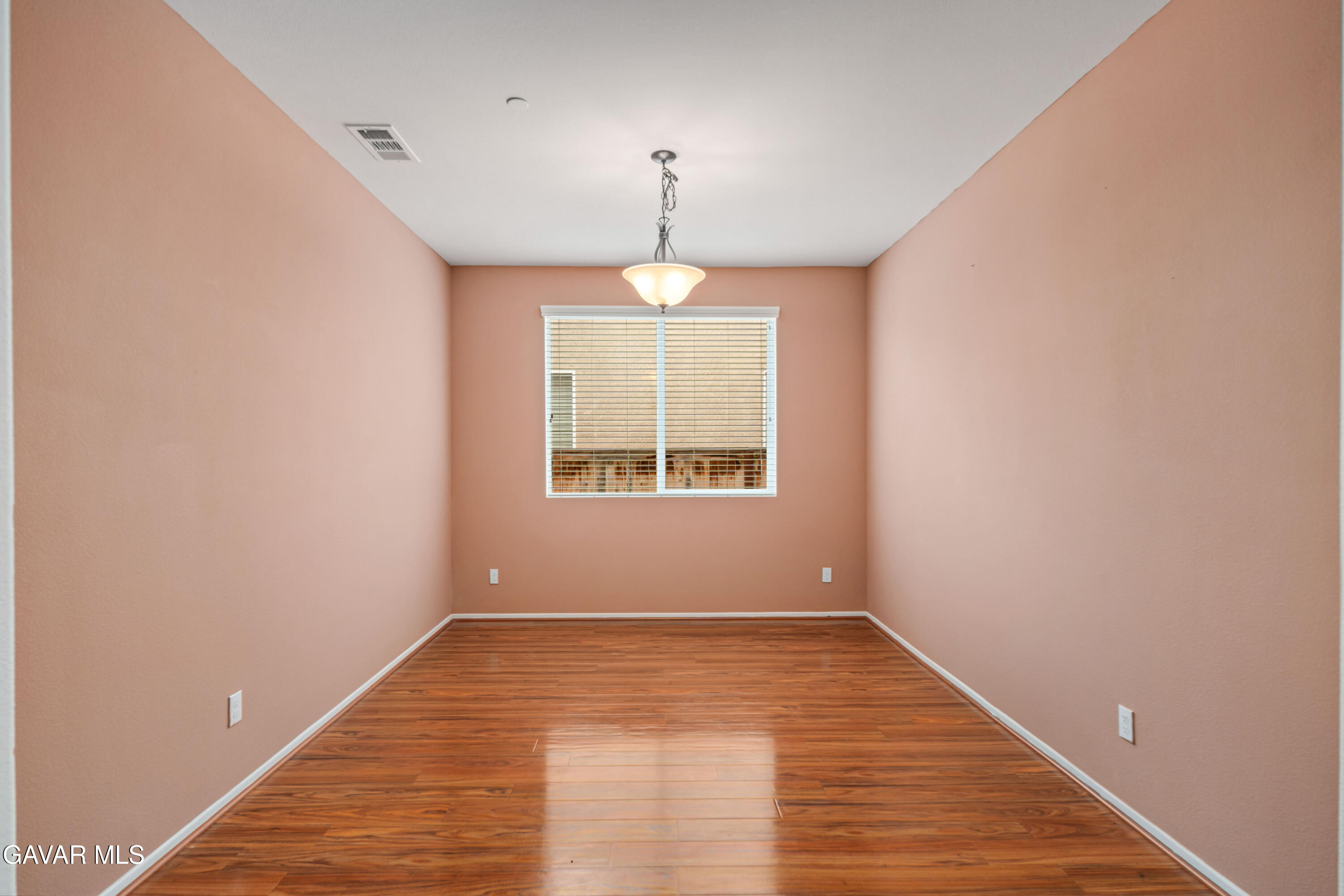 3024 Erica Avenue Rosamond, CA 93560 - Photo 11 of 32 wooden floor in an empty room with a window