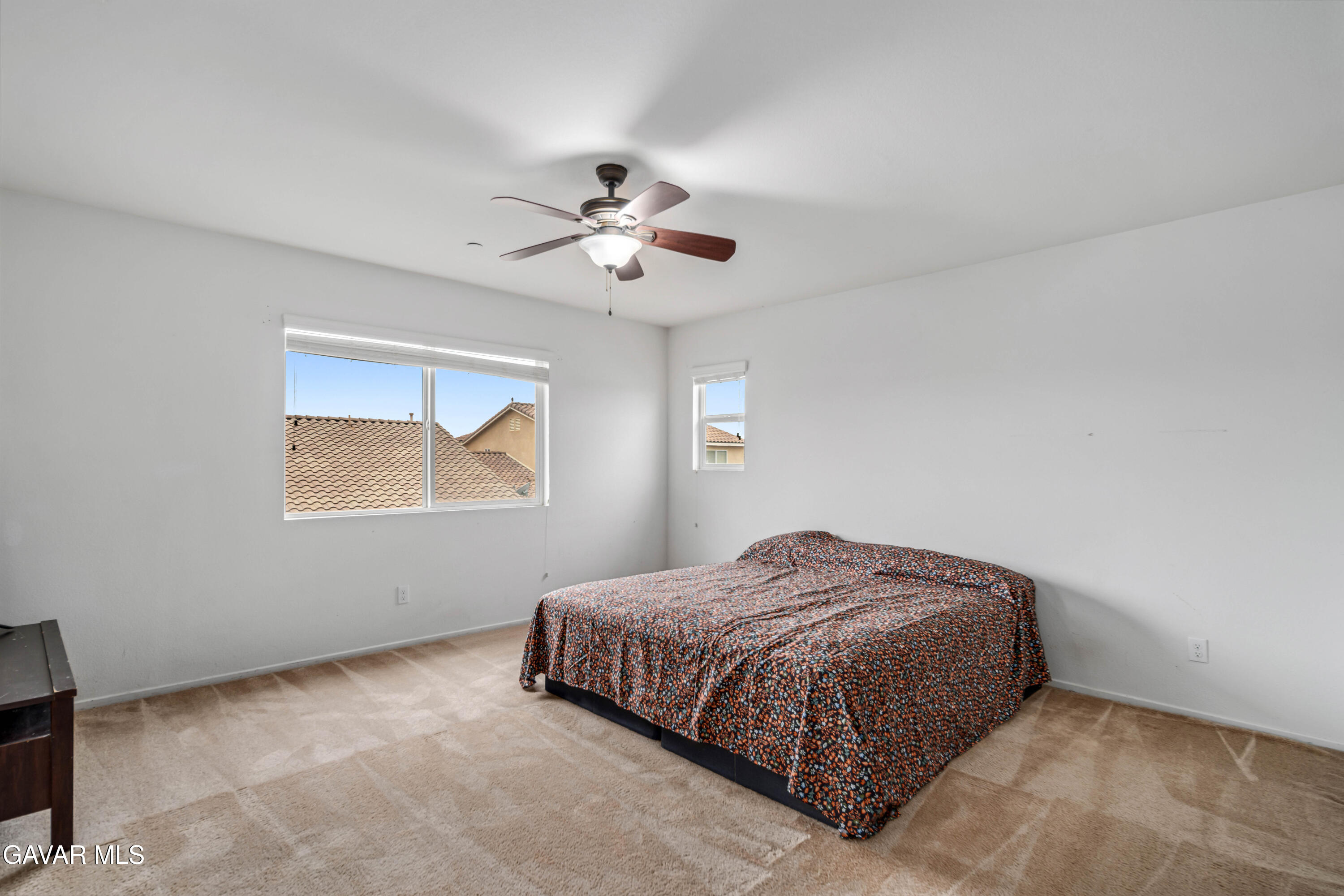 3024 Erica Avenue Rosamond, CA 93560 - Photo 19 of 32 a bedroom with a bed and window