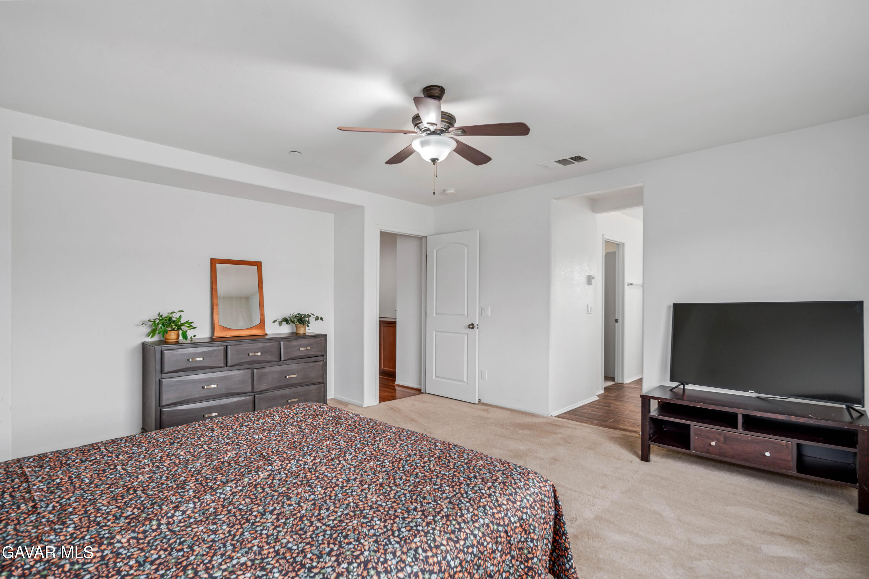 3024 Erica Avenue Rosamond, CA 93560 - Photo 20 of 32 a bedroom with a bed and a flat screen tv