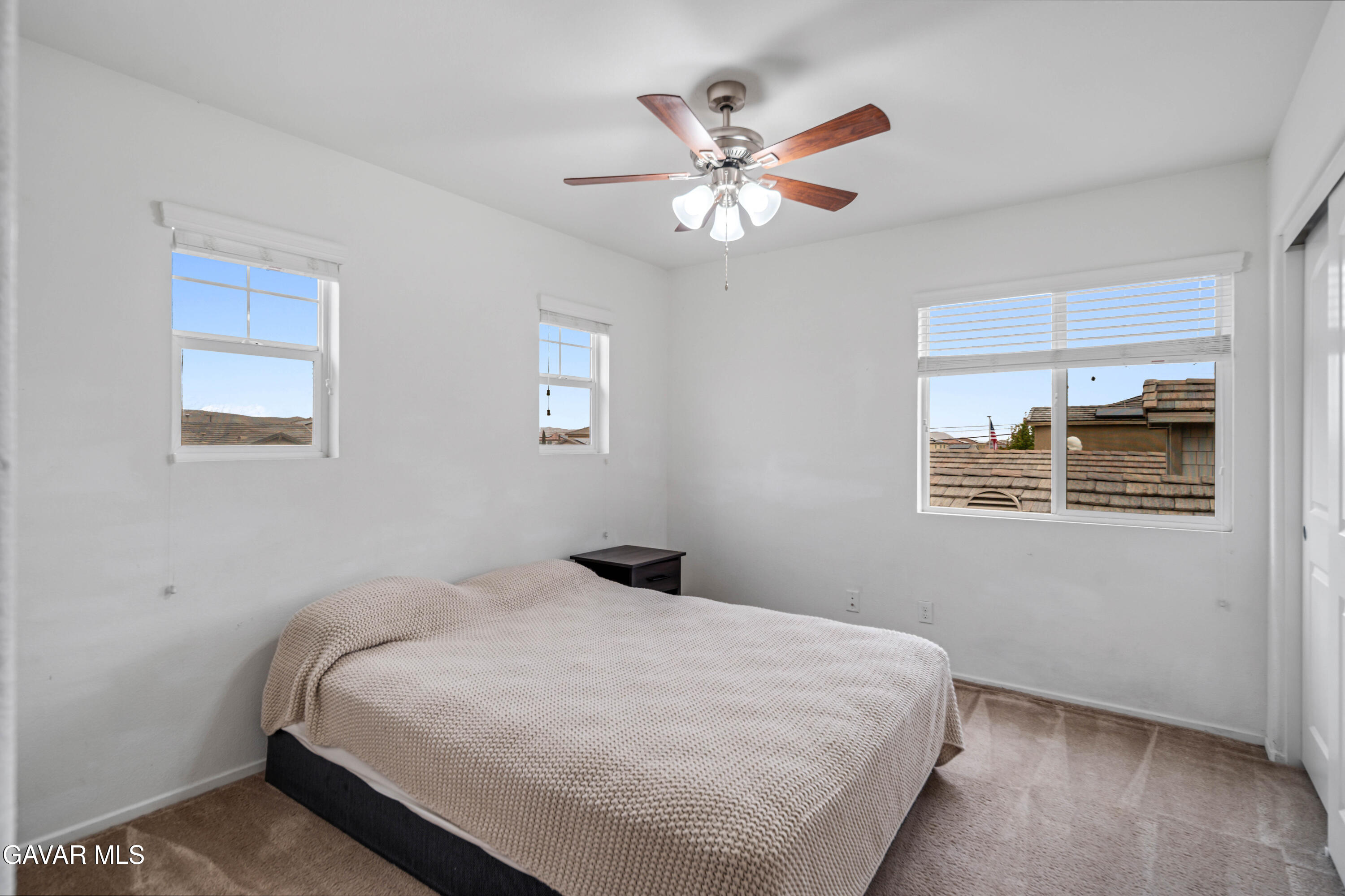 3024 Erica Avenue Rosamond, CA 93560 - Photo 24 of 32 a bedroom with a bed and a window