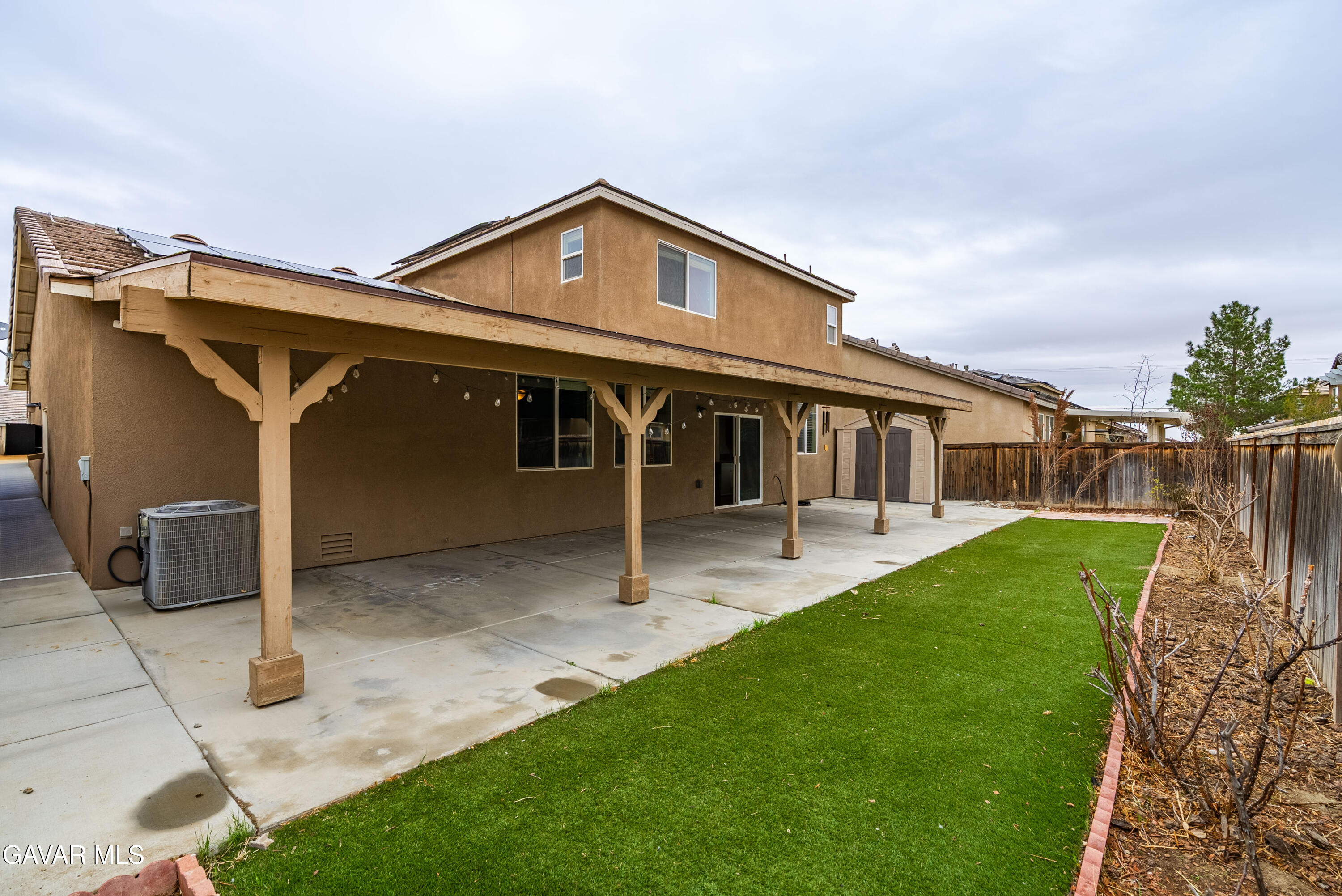 3024 Erica Avenue Rosamond, CA 93560 - Photo 30 of 32 a view of a house with a yard