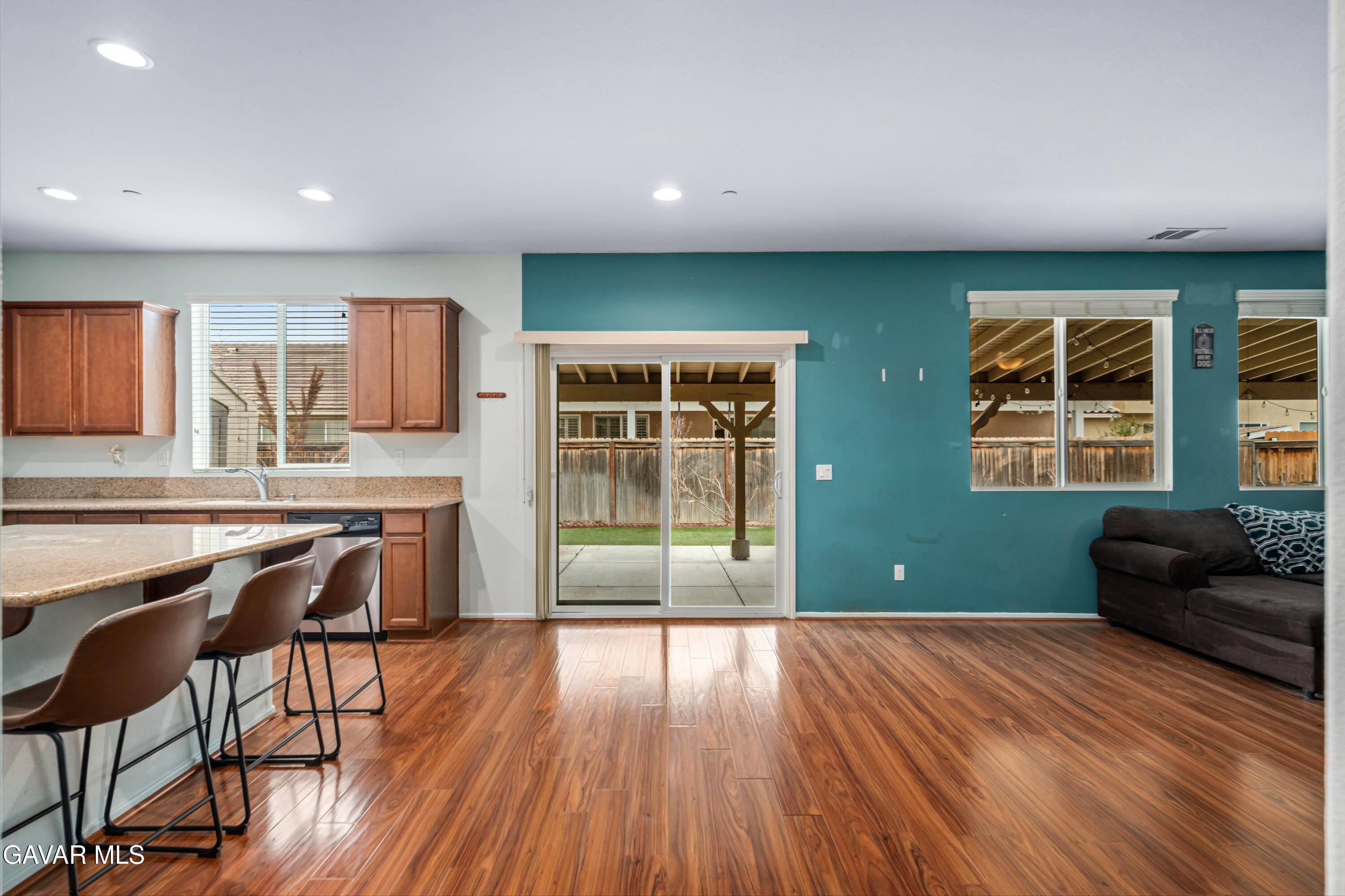 3024 Erica Avenue Rosamond, CA 93560 - Photo 5 of 32 a kitchen with a cabinets and wooden floor