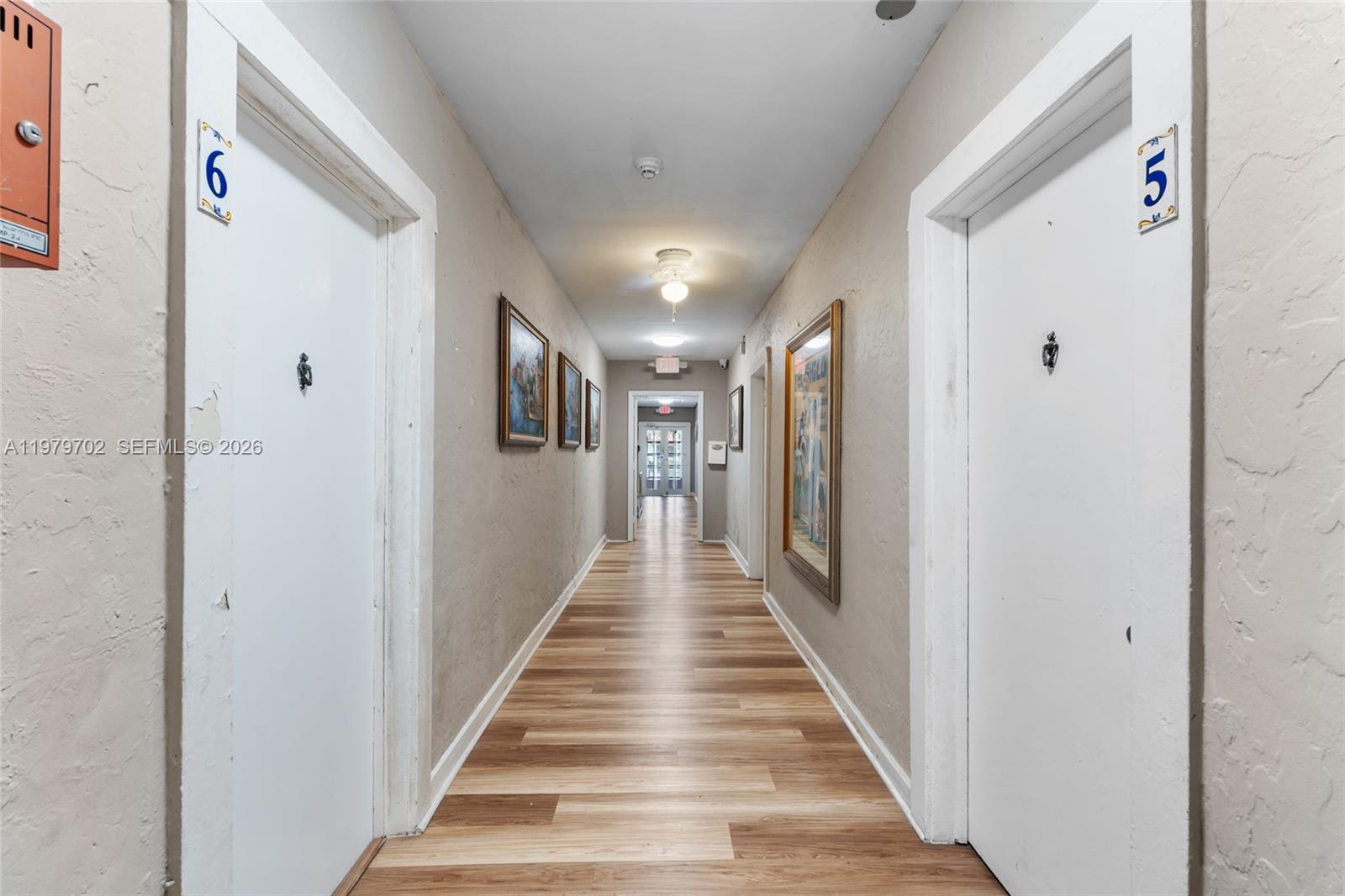 3409 South Le Jeune Road Coral Gables, FL 33134 - Photo 38 of 53 a view of a hallway with wooden floor and staircase