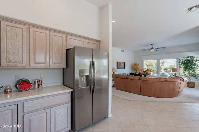 a kitchen with cabinets and stainless steel appliances
