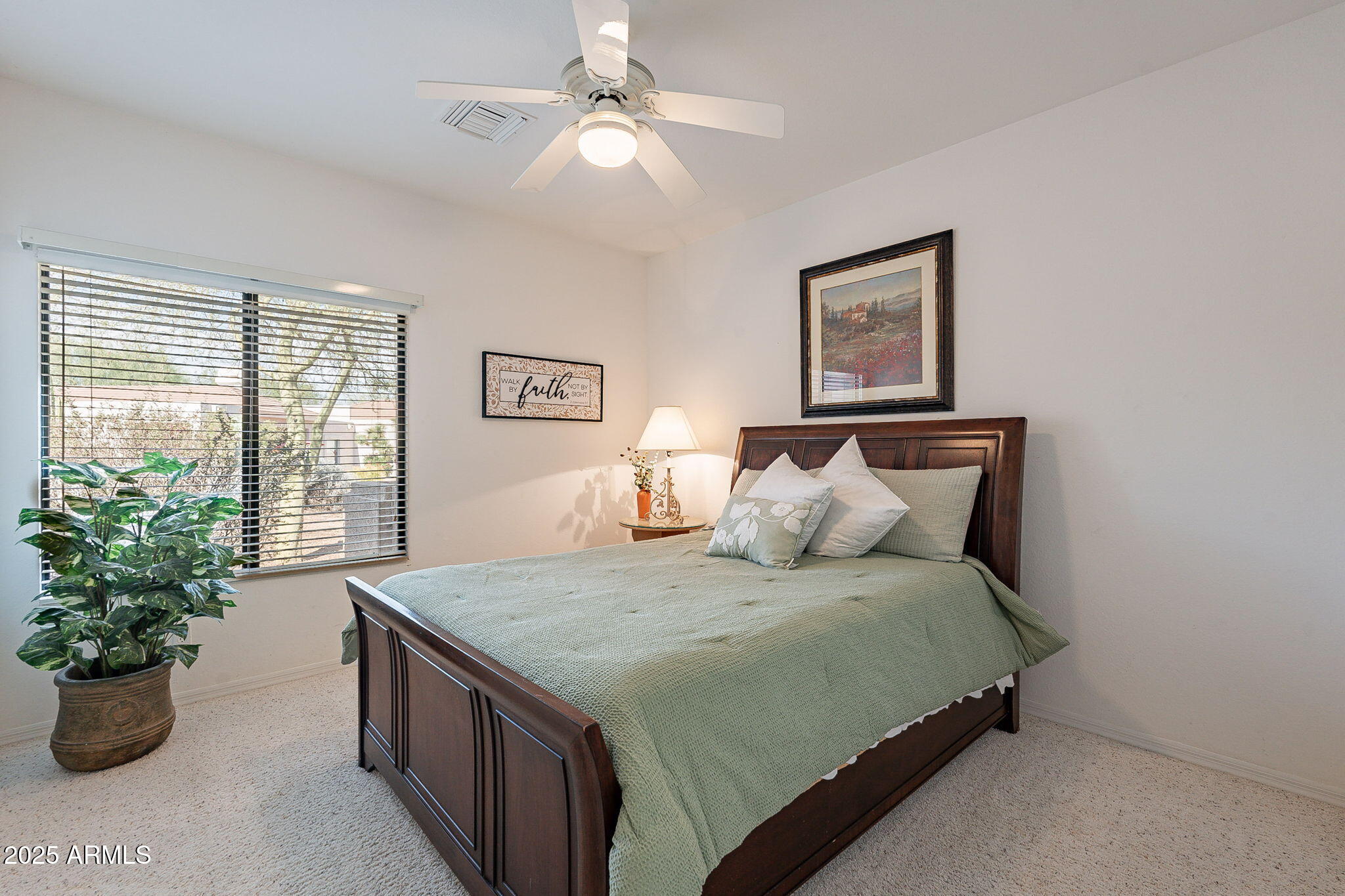 18637 Amarado Circle Rio Verde, AZ 85263 - Photo 25 of 51 a bedroom with a large bed and a potted plant