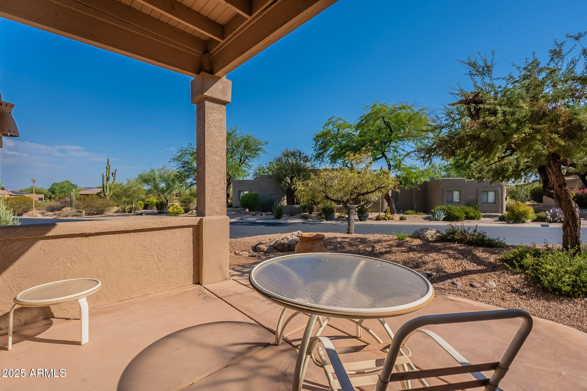 18637 Amarado Circle Rio Verde, AZ 85263 - Photo 27 of 51 a backyard of a house with yard table and chairs