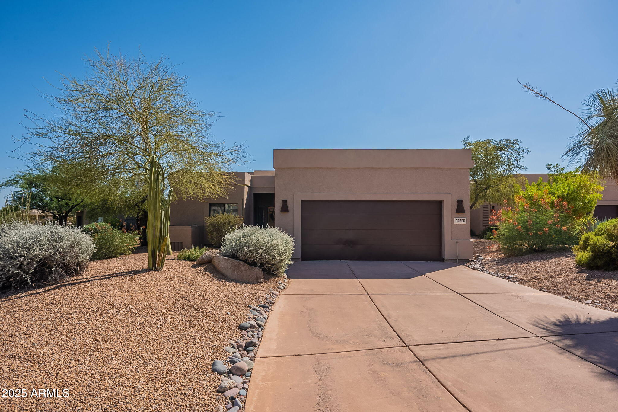 18637 Amarado Circle Rio Verde, AZ 85263 - Photo 3 of 51 a front view of a house with yard and garage