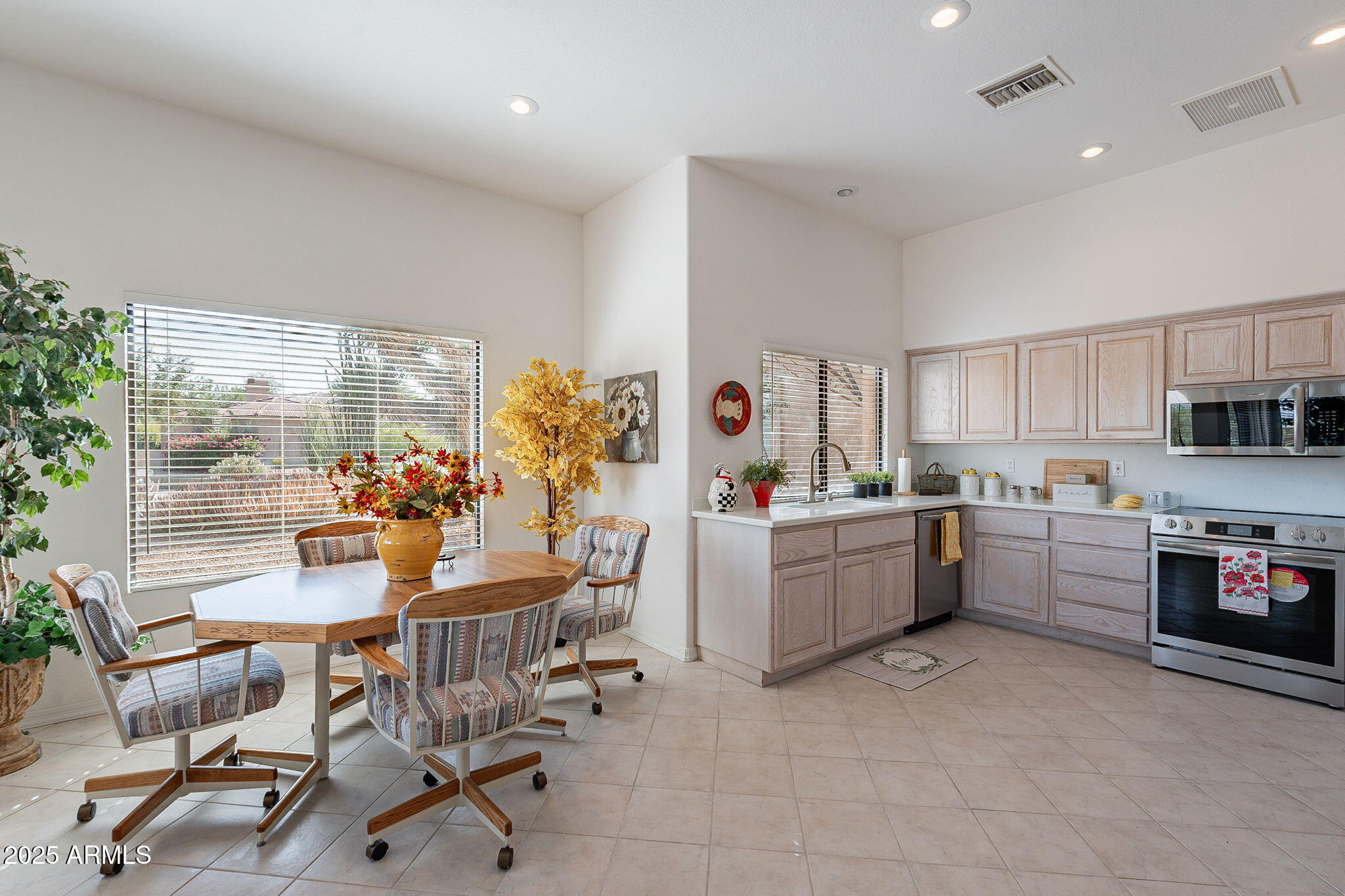 18637 Amarado Circle Rio Verde, AZ 85263 - Photo 6 of 51 a kitchen with a table and chairs in it