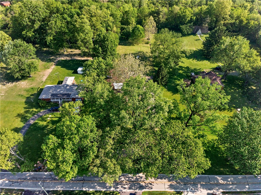 2684 Arthur Road Springfield, OH 45502 - Photo 66 of 69 This verdant aerial view showcases a residential property nestled amidst lush natural surroundings.