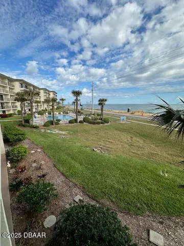 a view of a lake with a big yard