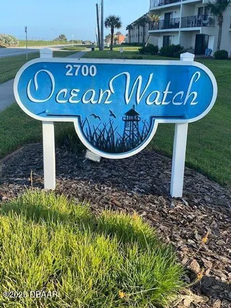 a sign that is on a brick wall