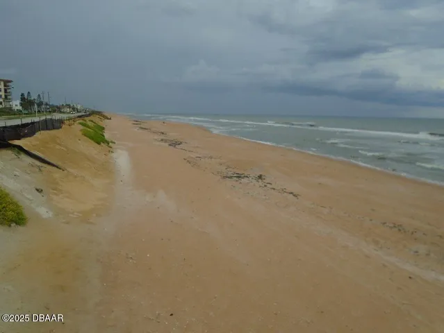 a view of a swimming pool with outdoor seating