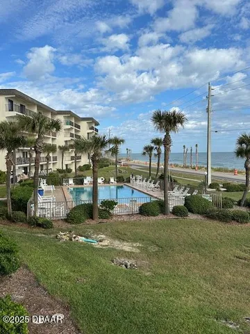 a view of a park with swings and slides
