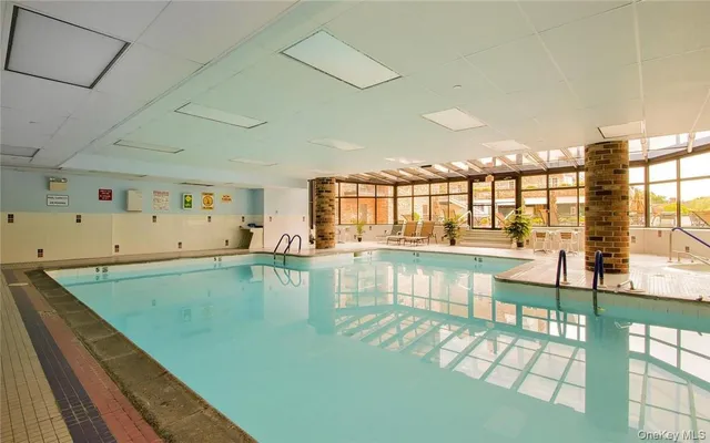 a view of a kitchen with a large window