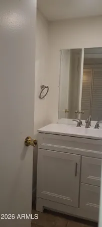 a bathroom with a sink and a mirror