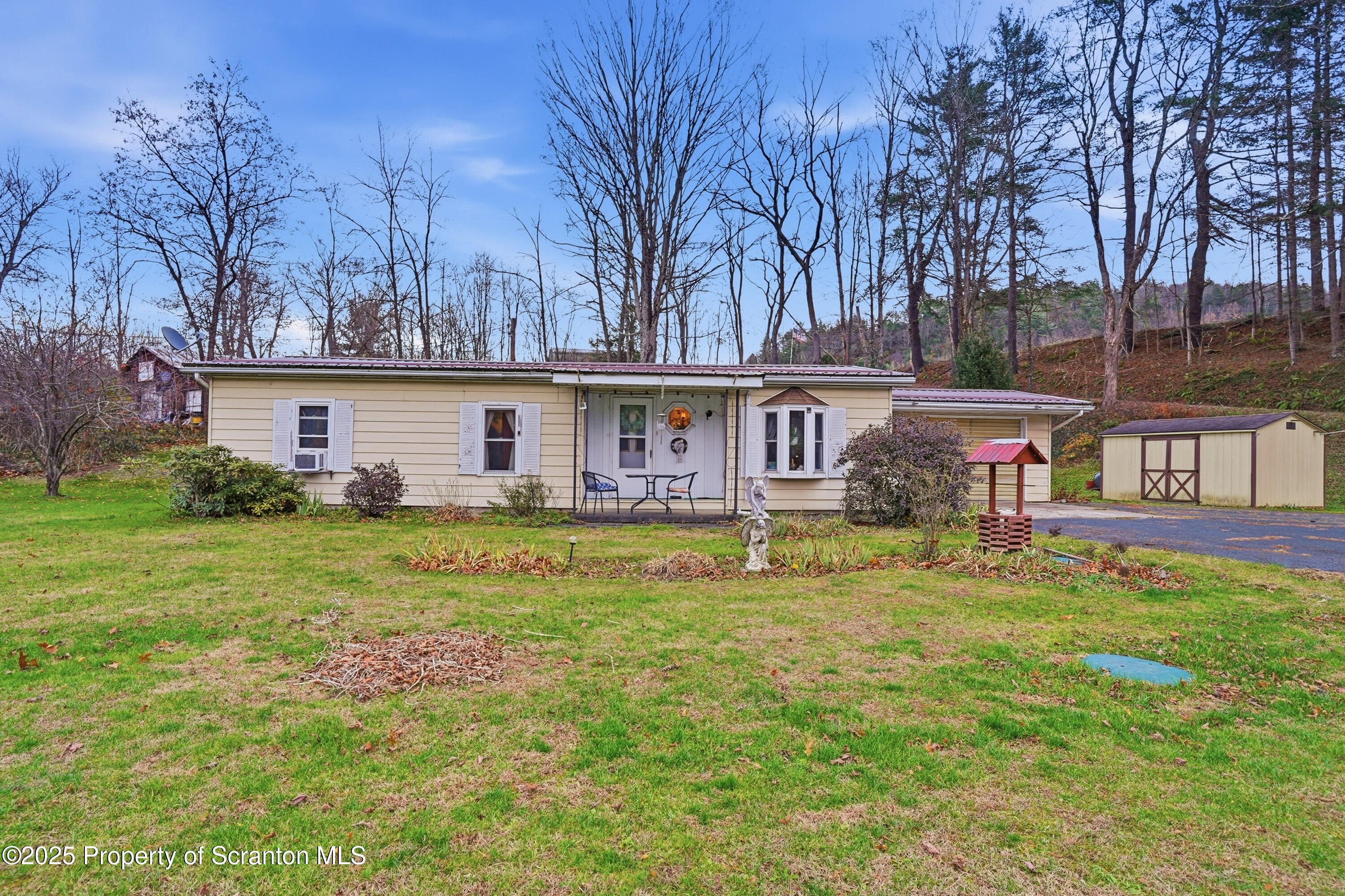 a front view of house with yard and seating area