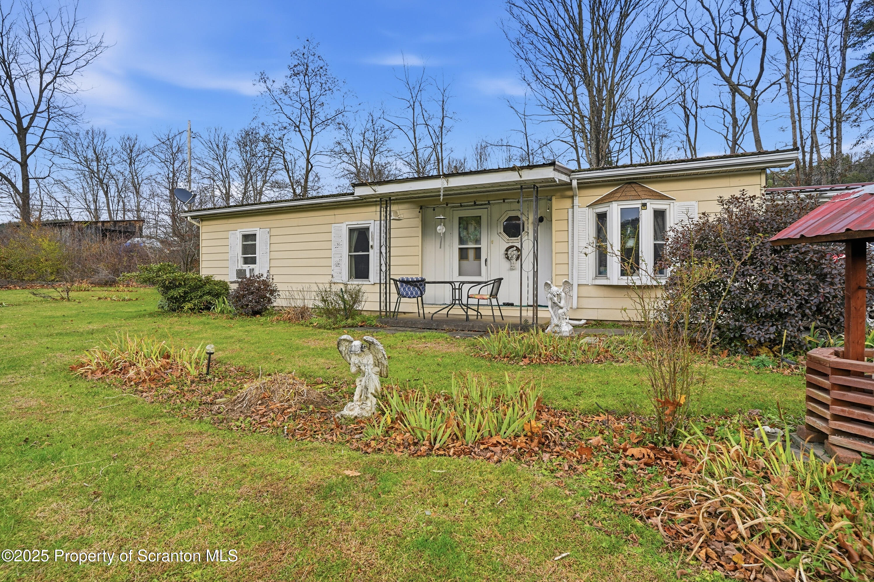 4794 Highway 706 Wyalusing, PA 18853 - Photo 2 of 40 a front view of a house with garden