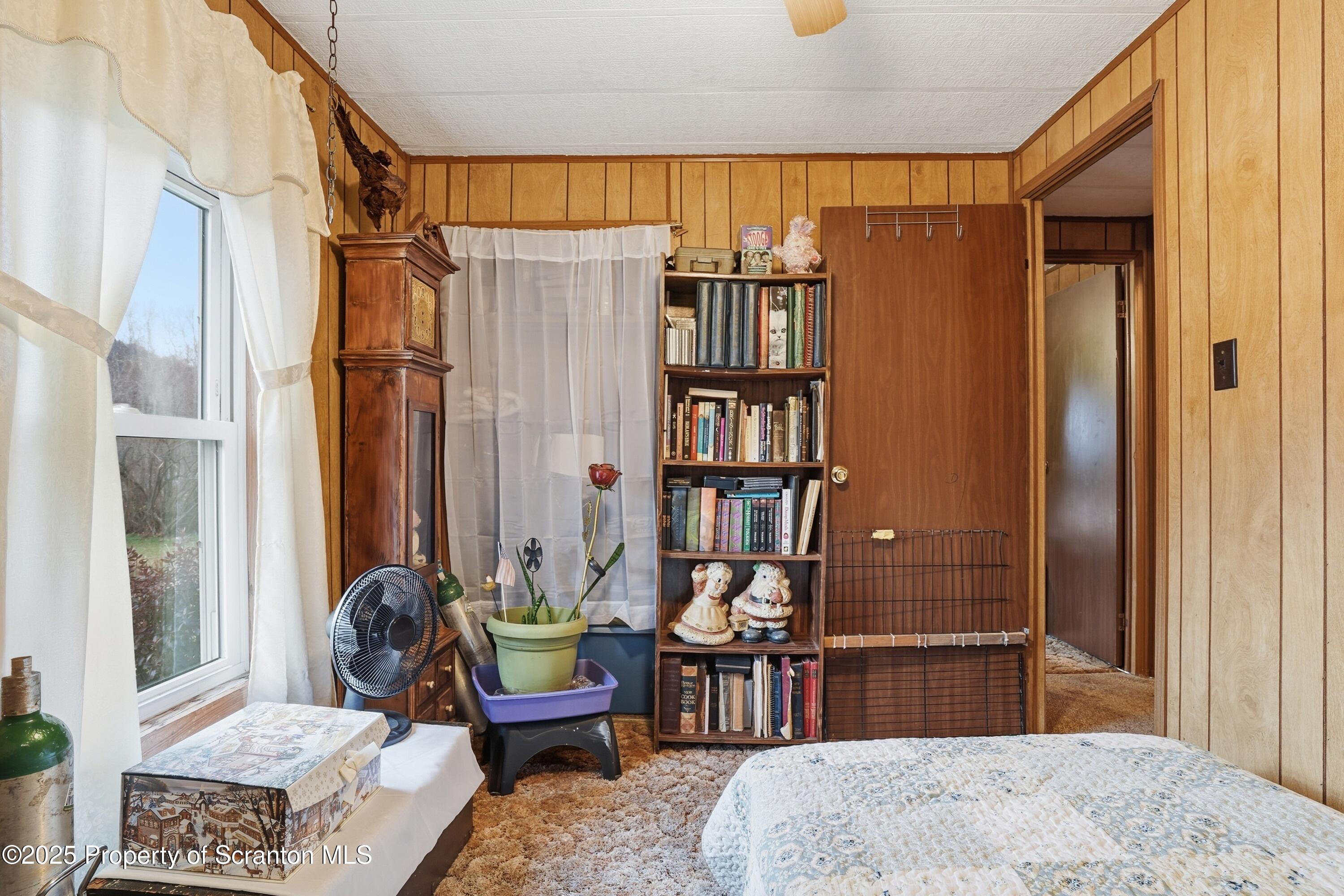 4794 Highway 706 Wyalusing, PA 18853 - Photo 24 of 40 a living room with furniture a rug and a window