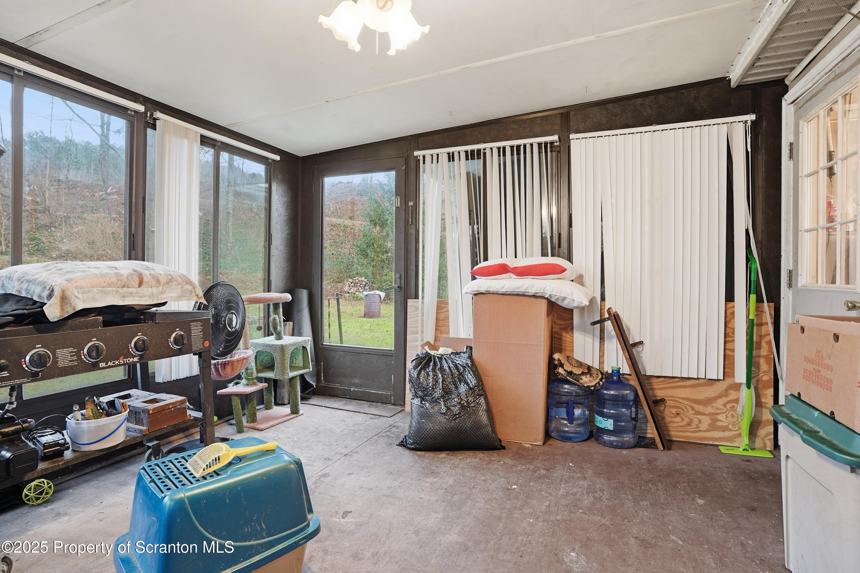 4794 Highway 706 Wyalusing, PA 18853 - Photo 29 of 40 a room with furniture and a large window