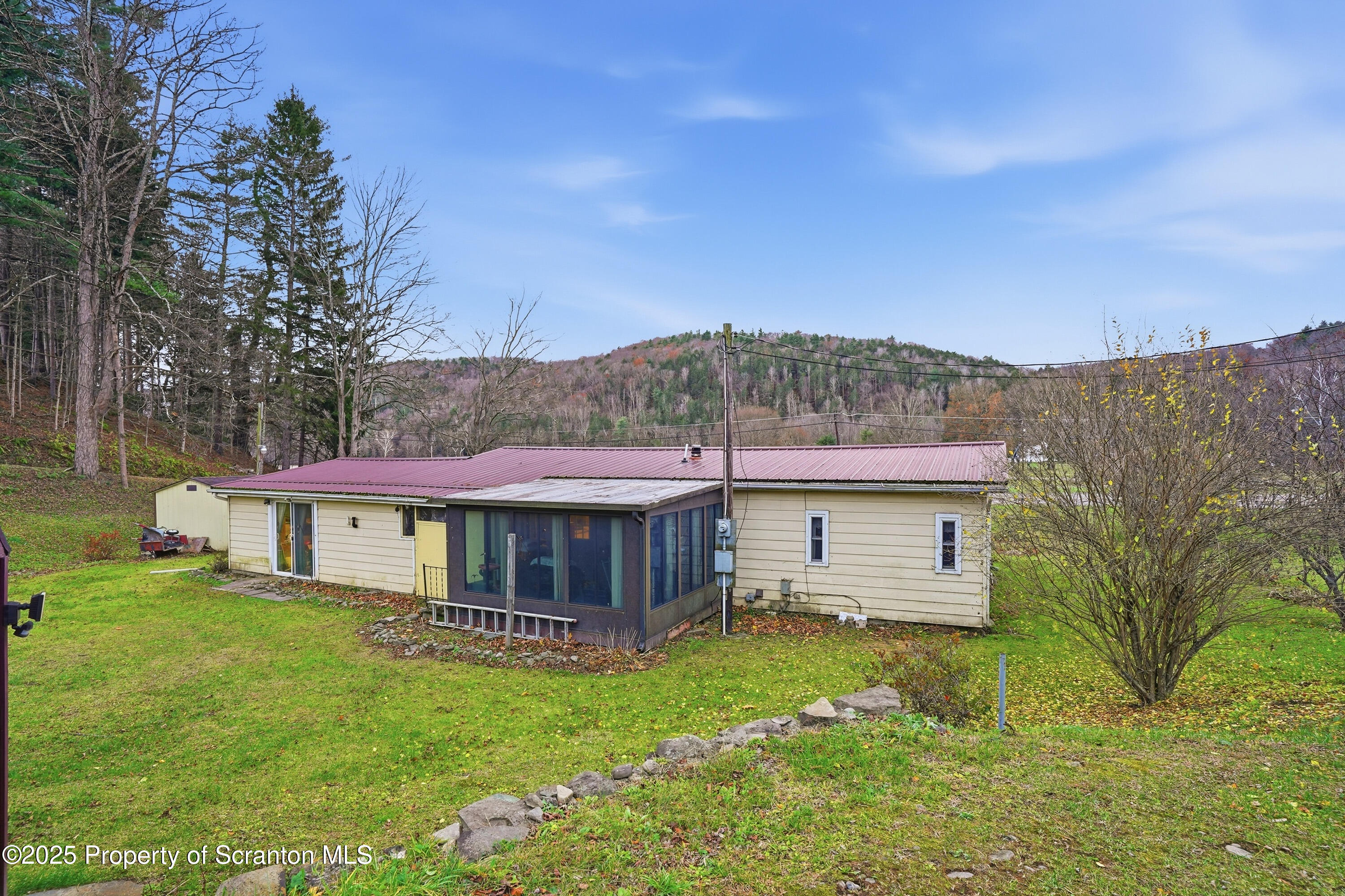 4794 Highway 706 Wyalusing, PA 18853 - Photo 32 of 40 a front view of a house with a garden