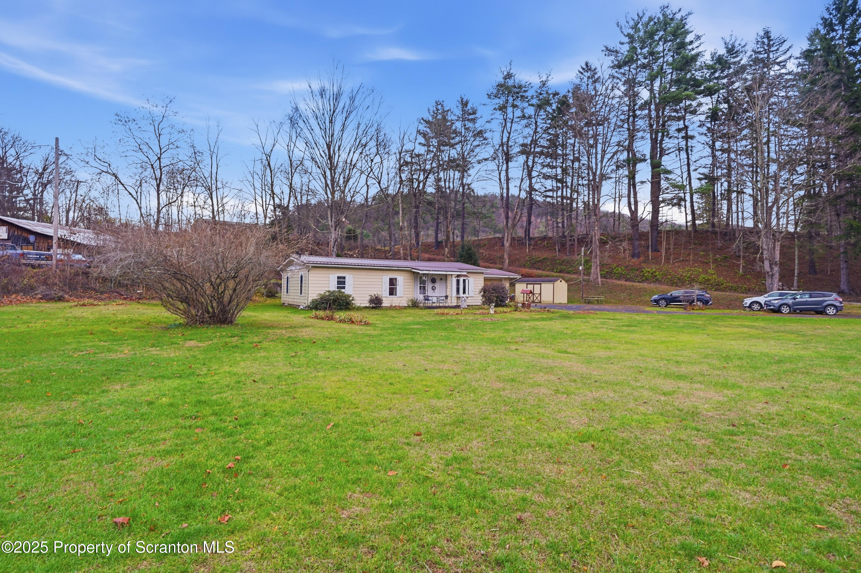 4794 Highway 706 Wyalusing, PA 18853 - Photo 4 of 40 a view of a house with a yard and sitting area