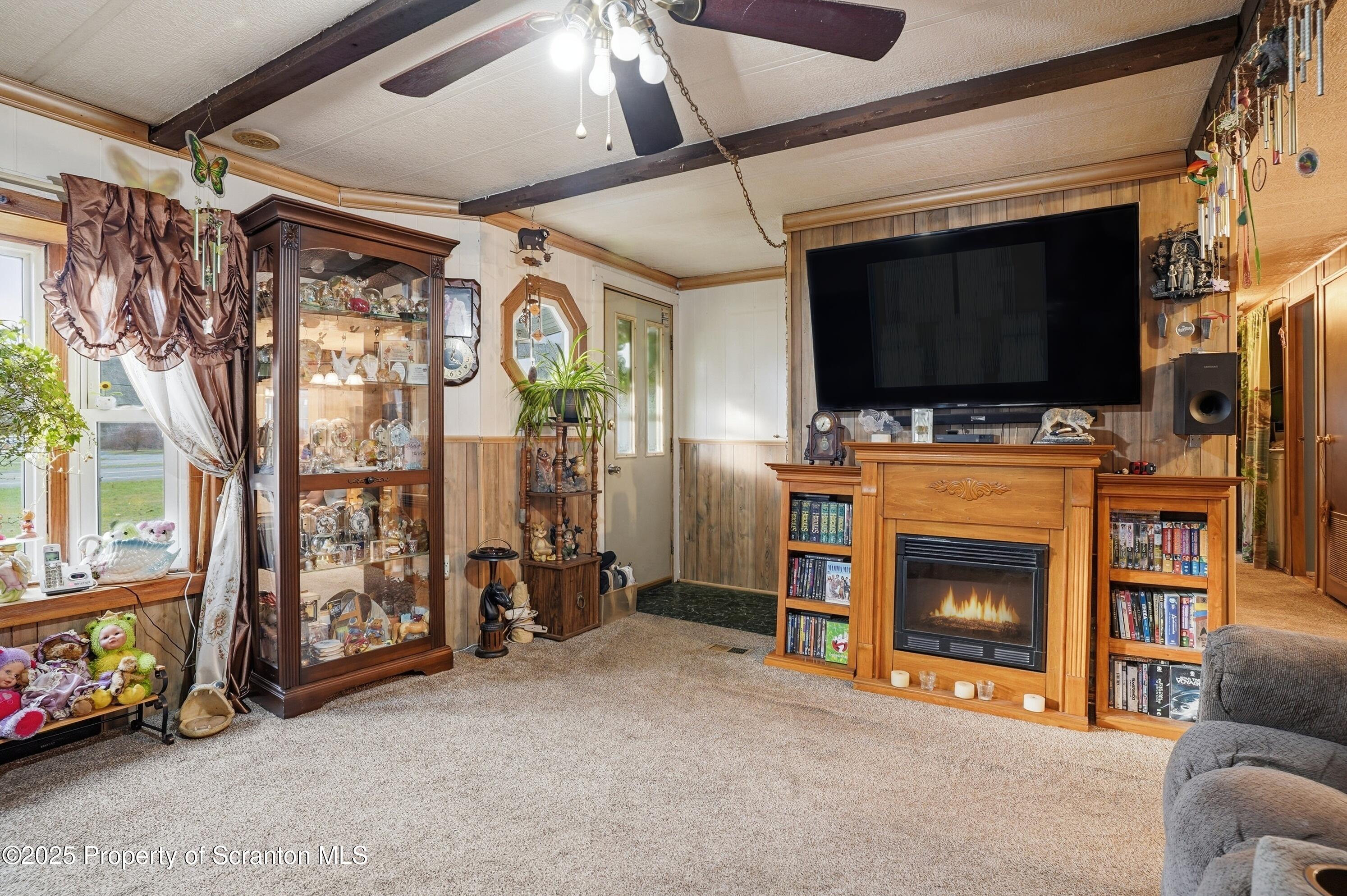 4794 Highway 706 Wyalusing, PA 18853 - Photo 7 of 40 a living room with furniture and a flat screen tv