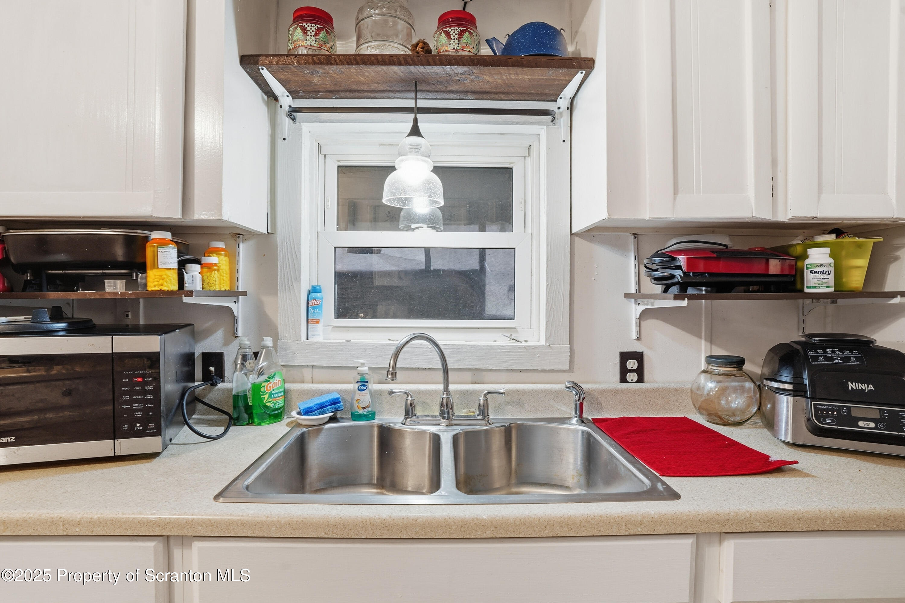 4794 Highway 706 Wyalusing, PA 18853 - Photo 9 of 40 a kitchen with a sink cabinets and a stove