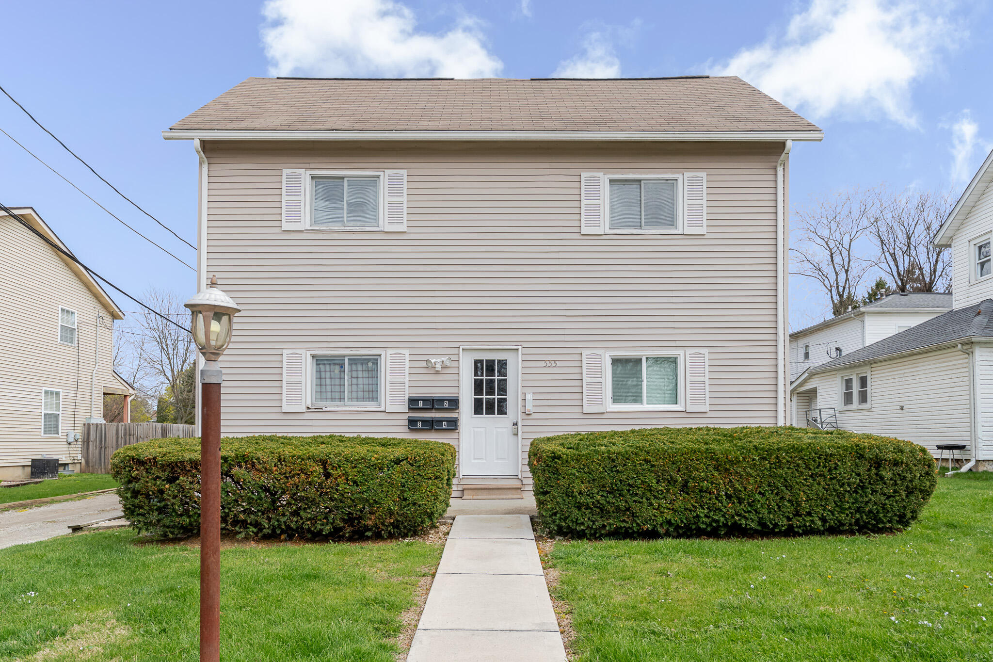 a front view of a house with a yard
