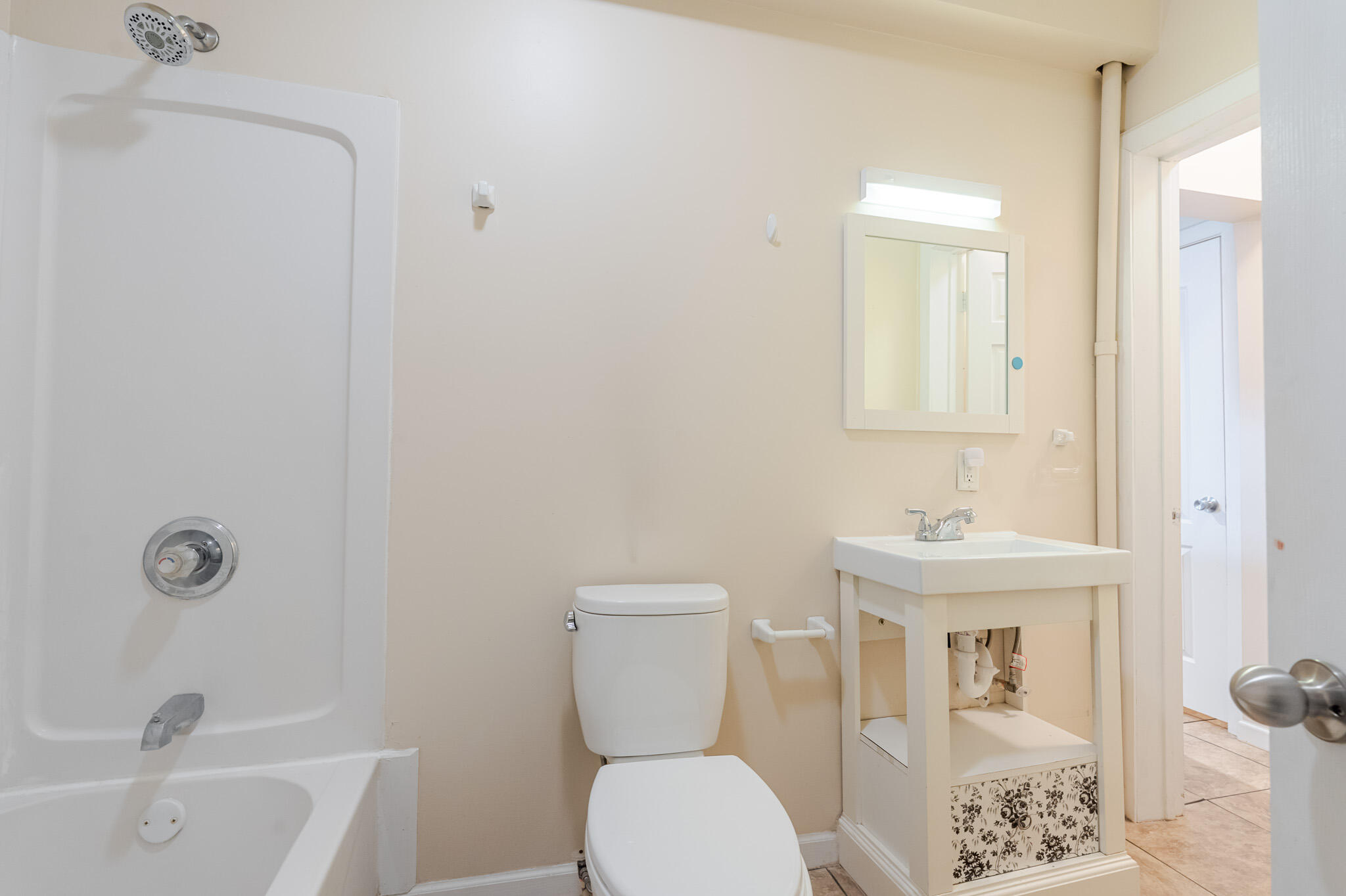 555 South Locust Street, Unit 2 Valparaiso, IN 46383 - Photo 6 of 8 a bathroom with a toilet a sink and bathtub