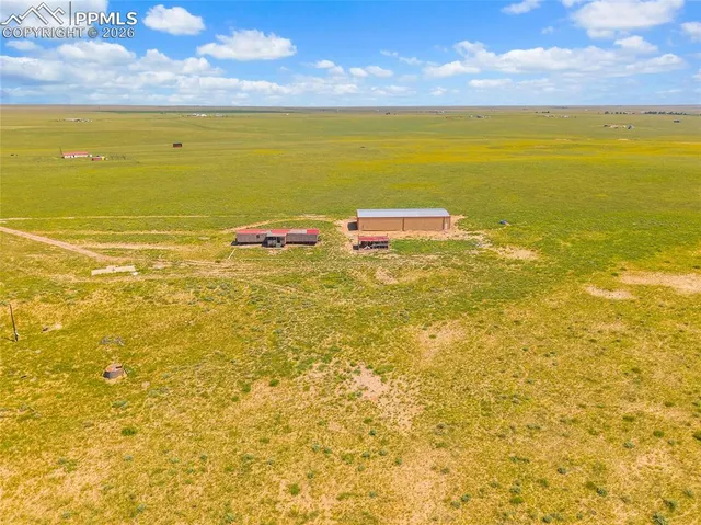 a view of an ocean & house