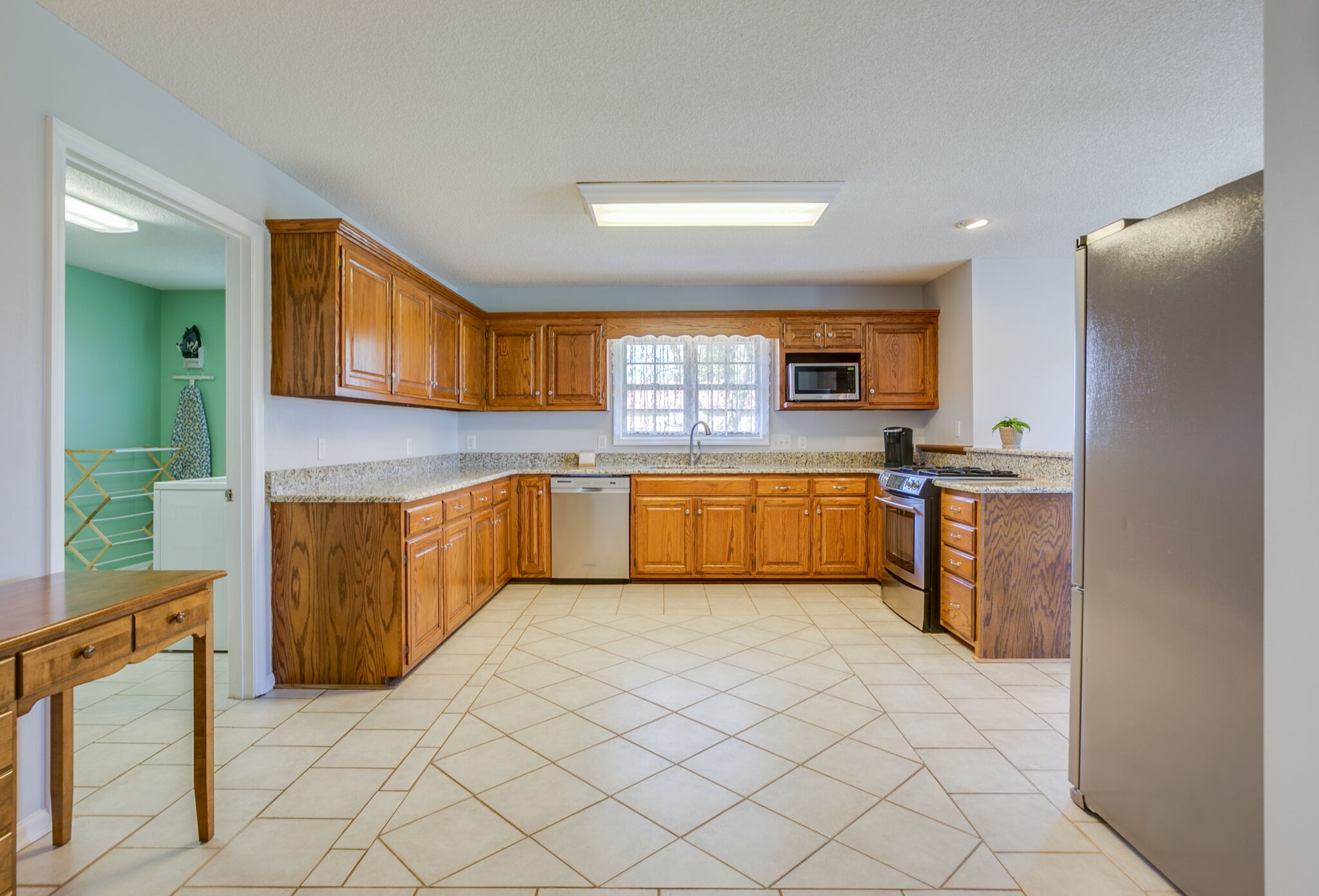 3428 Midland Road Bell Buckle, TN 37020 - Photo 14 of 41 a kitchen with granite countertop a sink stainless steel appliances and cabinets