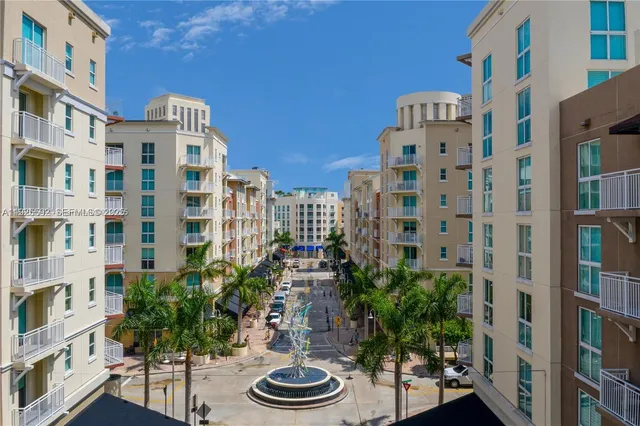 a building view with tall trees
