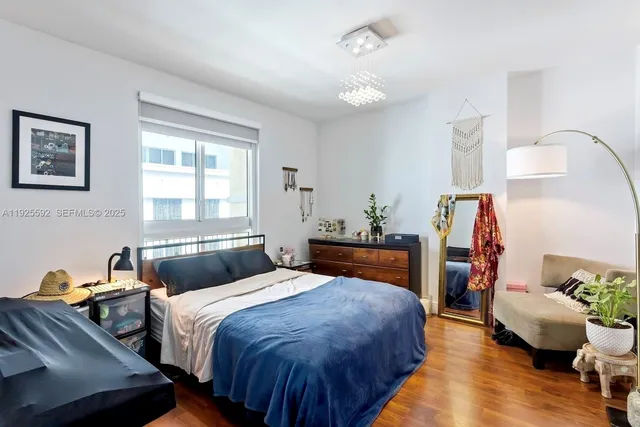 a bedroom with bed and window