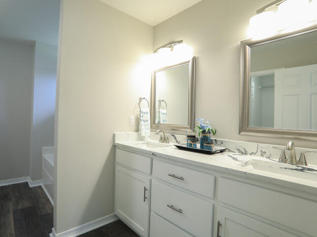 6330 Possum Ridge Road Crestview, FL 32539 - Photo 12 of 22 a bathroom with a double vanity sink and a mirror