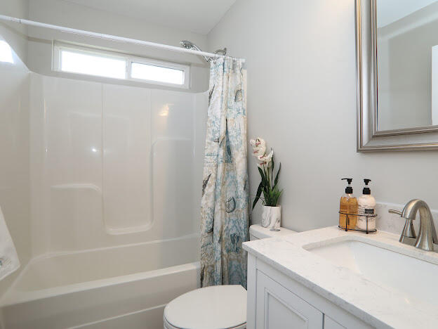 6330 Possum Ridge Road Crestview, FL 32539 - Photo 14 of 22 a bathroom with a sink toilet and shower