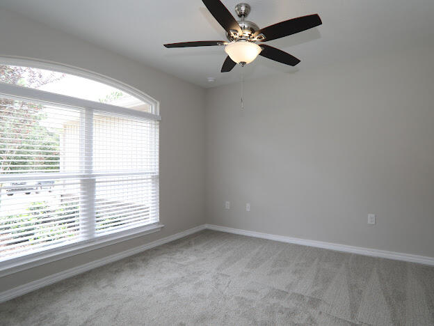 6330 Possum Ridge Road Crestview, FL 32539 - Photo 16 of 22 an empty room with a window and a fan