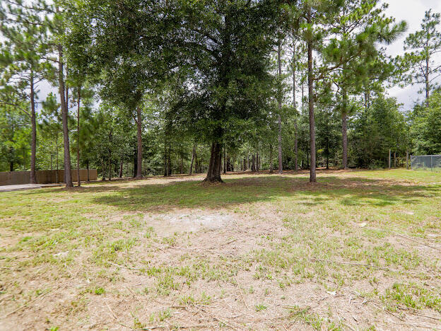 6330 Possum Ridge Road Crestview, FL 32539 - Photo 21 of 22 a view of outdoor space with trees