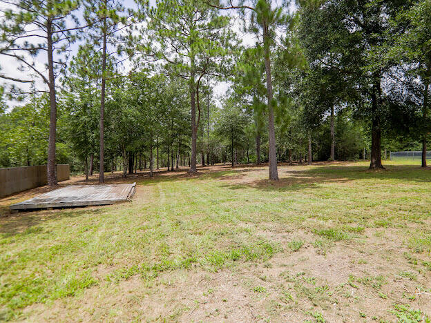 6330 Possum Ridge Road Crestview, FL 32539 - Photo 22 of 22 a swimming pool with trees in the background